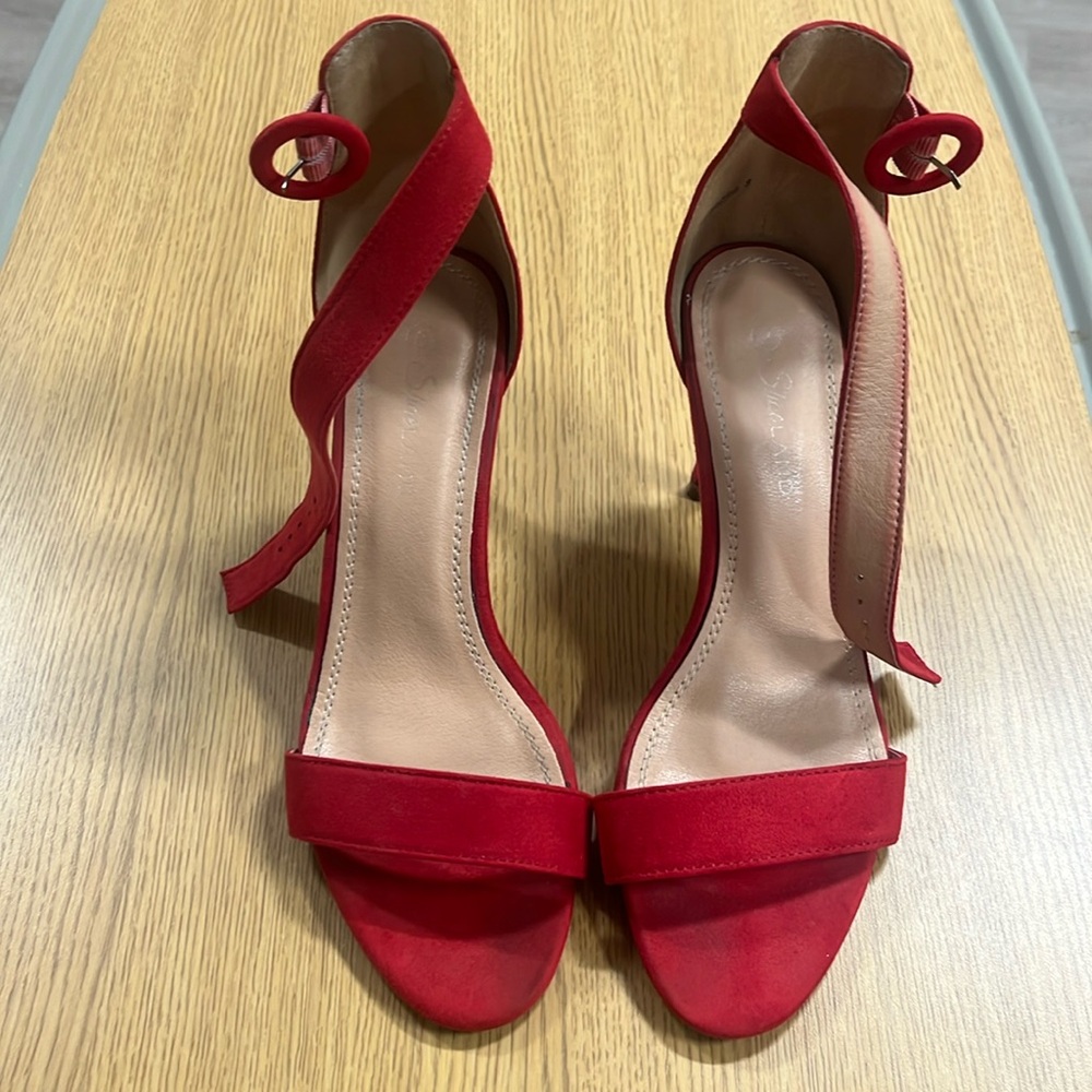 Red suede strapy high heel sandles. Size 8. Slightly worn. Great condition.